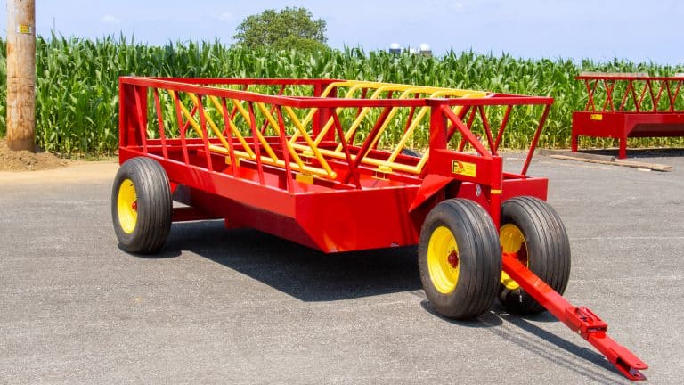 exterior photo of quality 700 drb no waste hay feeder for cattle for sale by cornfield