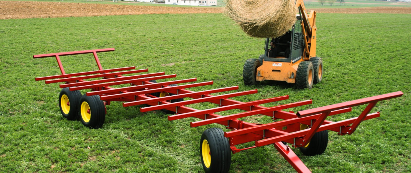 A bale wagon being loaded